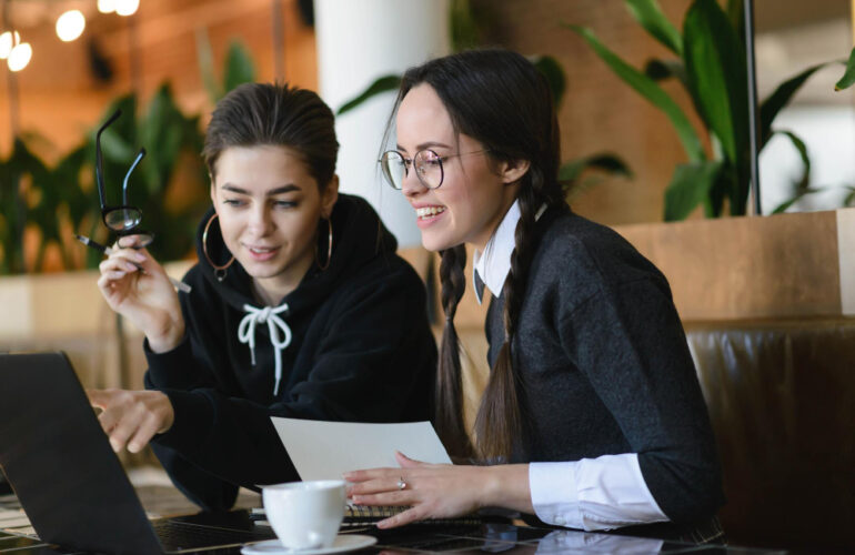 Young professionals in their 20s working on laptops, networking at events, and receiving mentorship, with modern office and digital tools in the background